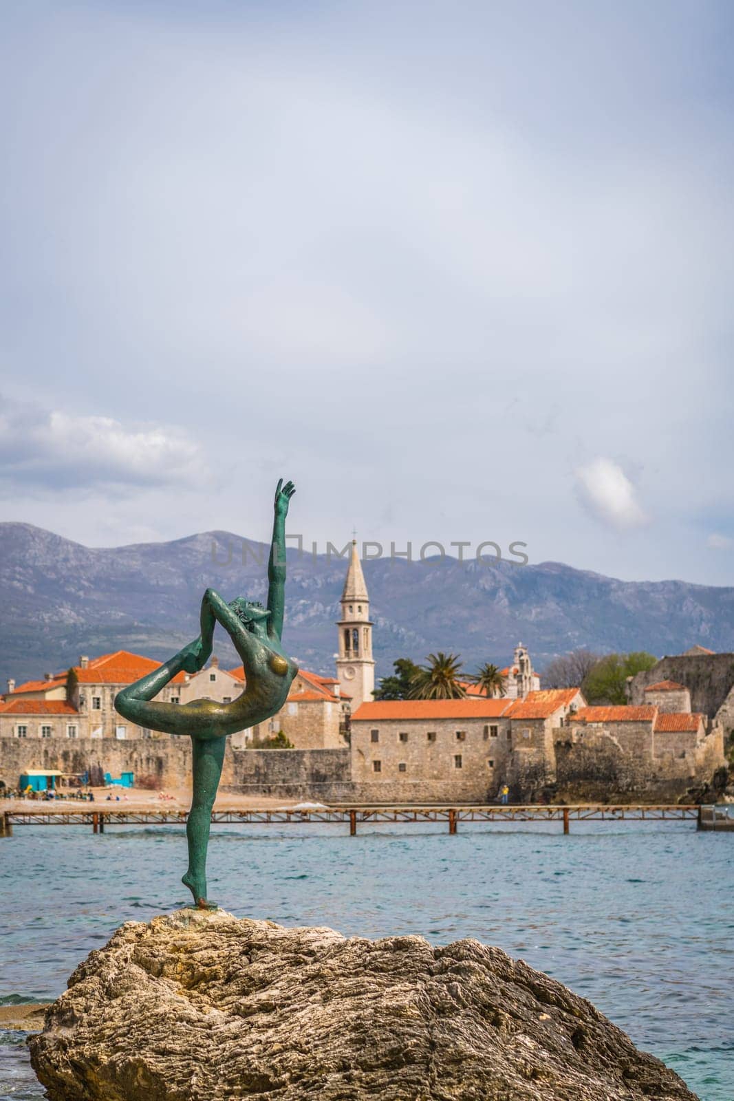 Budva, Montenegro - April 2018 :  The statue of Ballerina Dancer, standing on the rock, Budva landmark, Montenegro