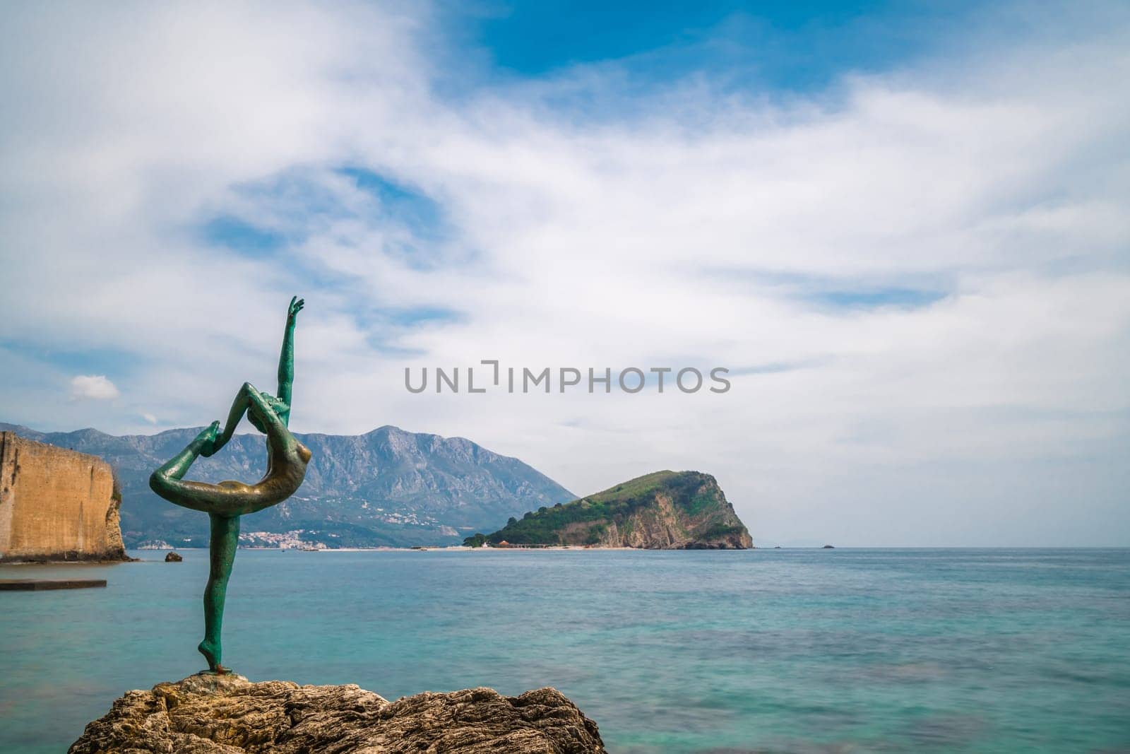 Budva, Montenegro - April 2018 :  The statue of Ballerina Dancer, standing on the rock, Budva landmark, Montenegro
