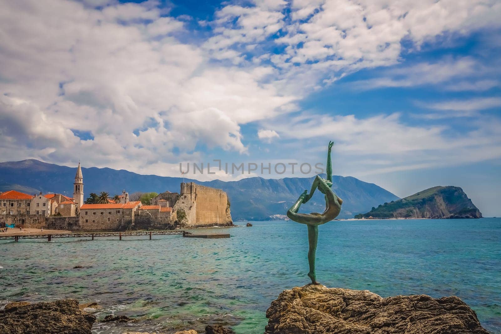 Budva, Montenegro - April 2018 :  The statue of Ballerina Dancer, standing on the rock, Budva landmark, Montenegro