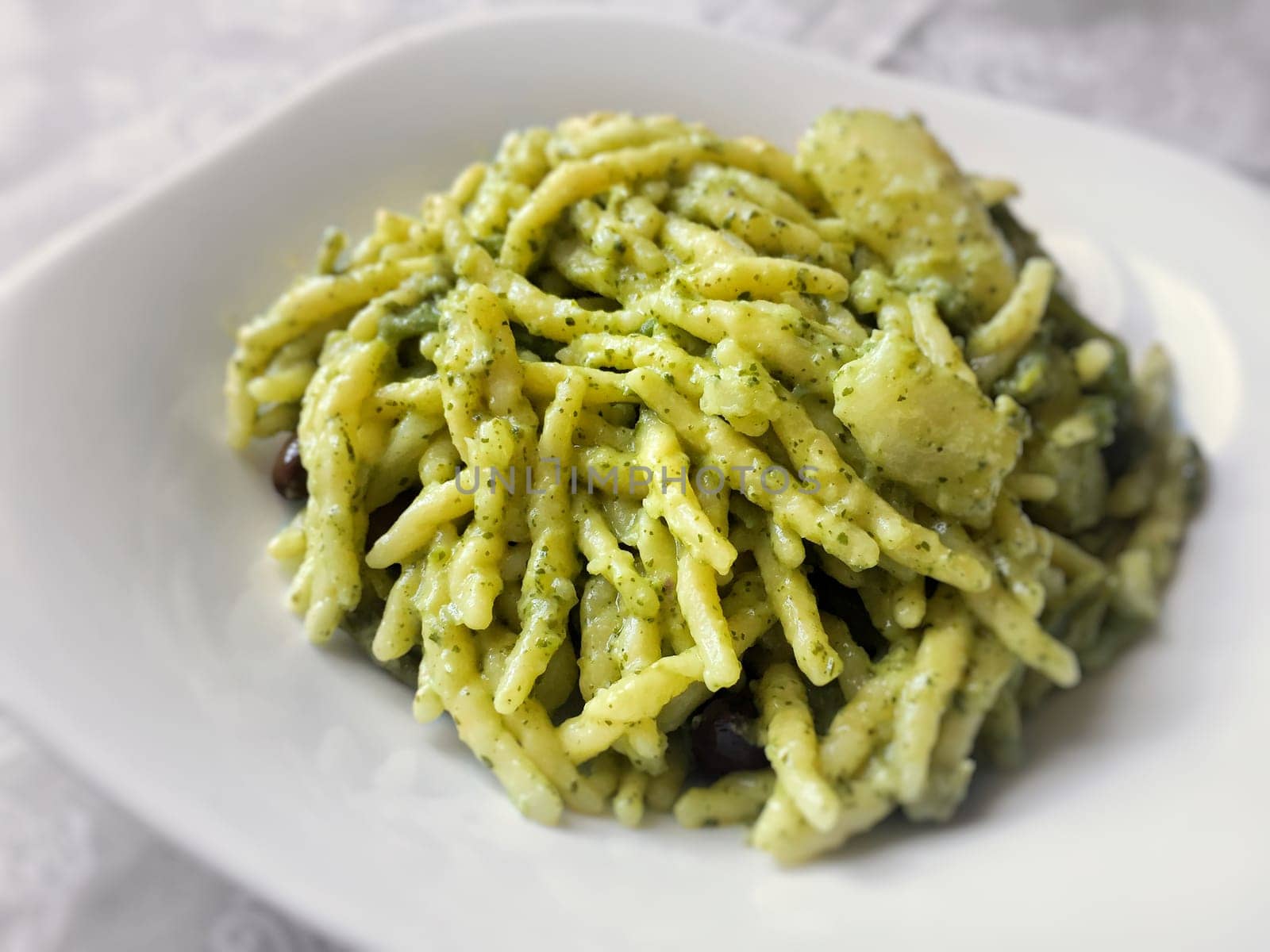 Italian trofie pasta with traditional pesto sauce. Restaurant and food concept