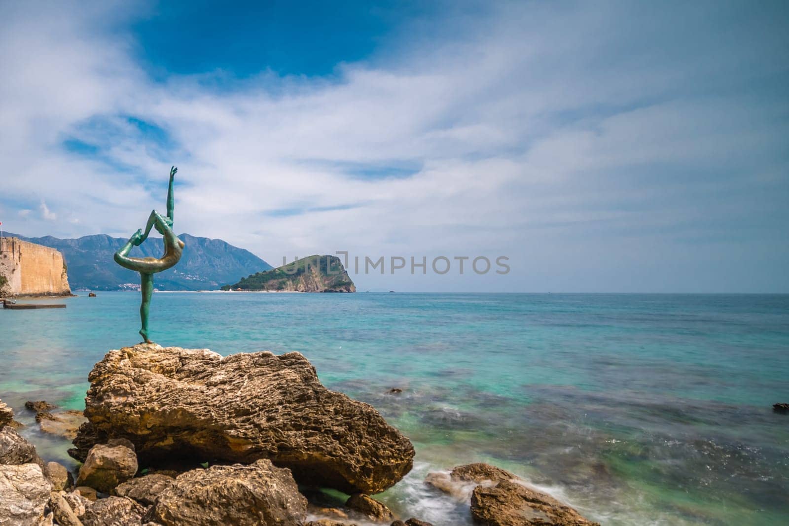 Budva, Montenegro - April 2018 :  The statue of Ballerina Dancer, standing on the rock, Budva landmark, Montenegro