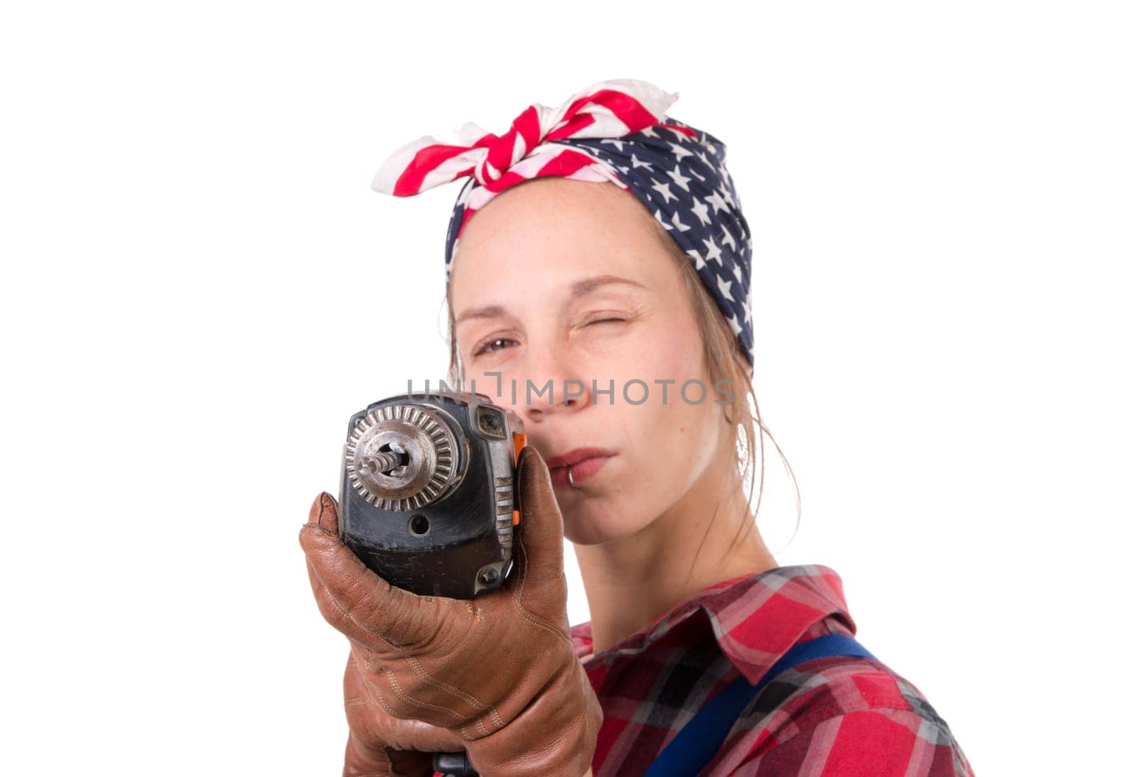 Vintage pretty young woman with a drill on the white background