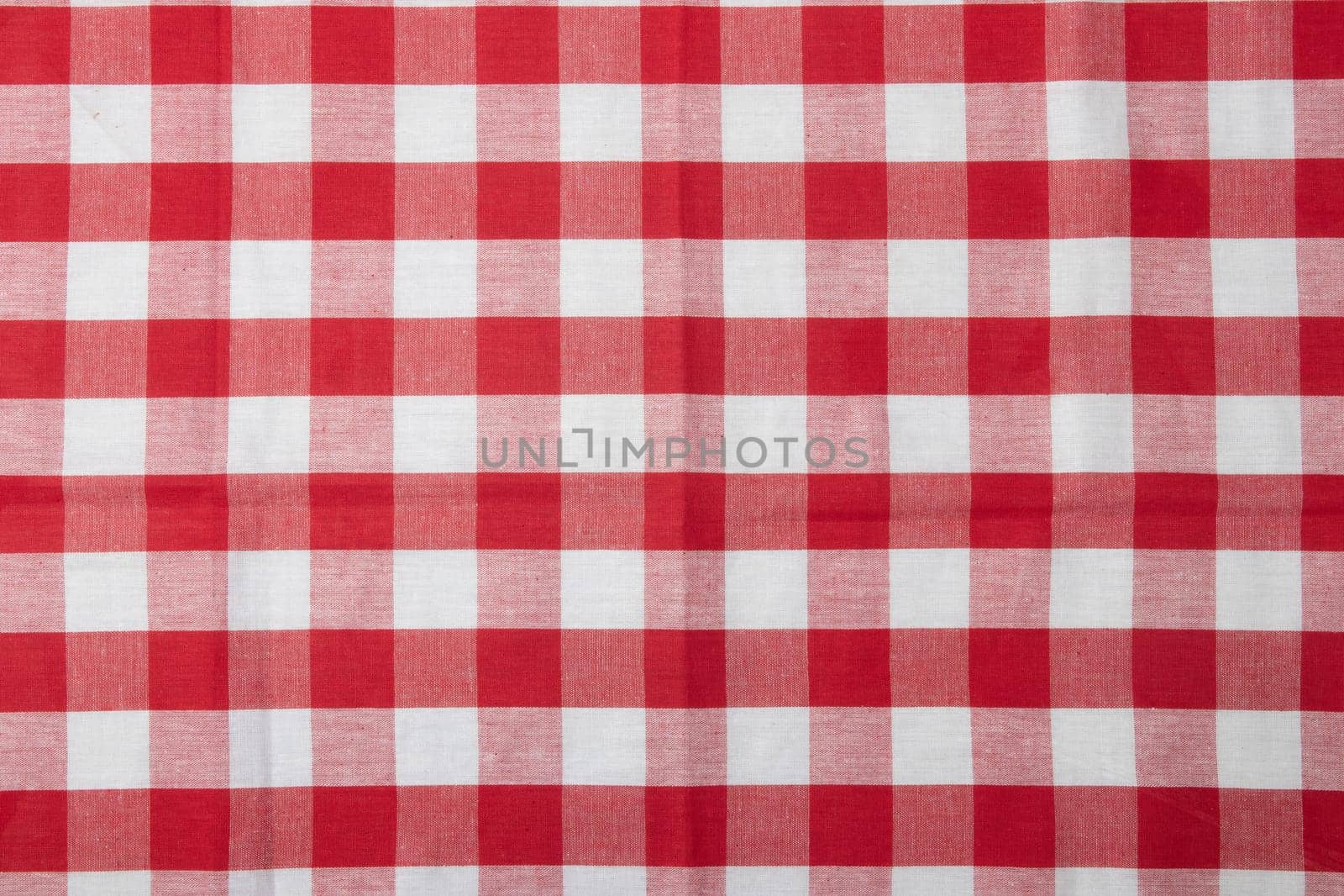 Red and white checkered napkin. Kitchen accessories.
