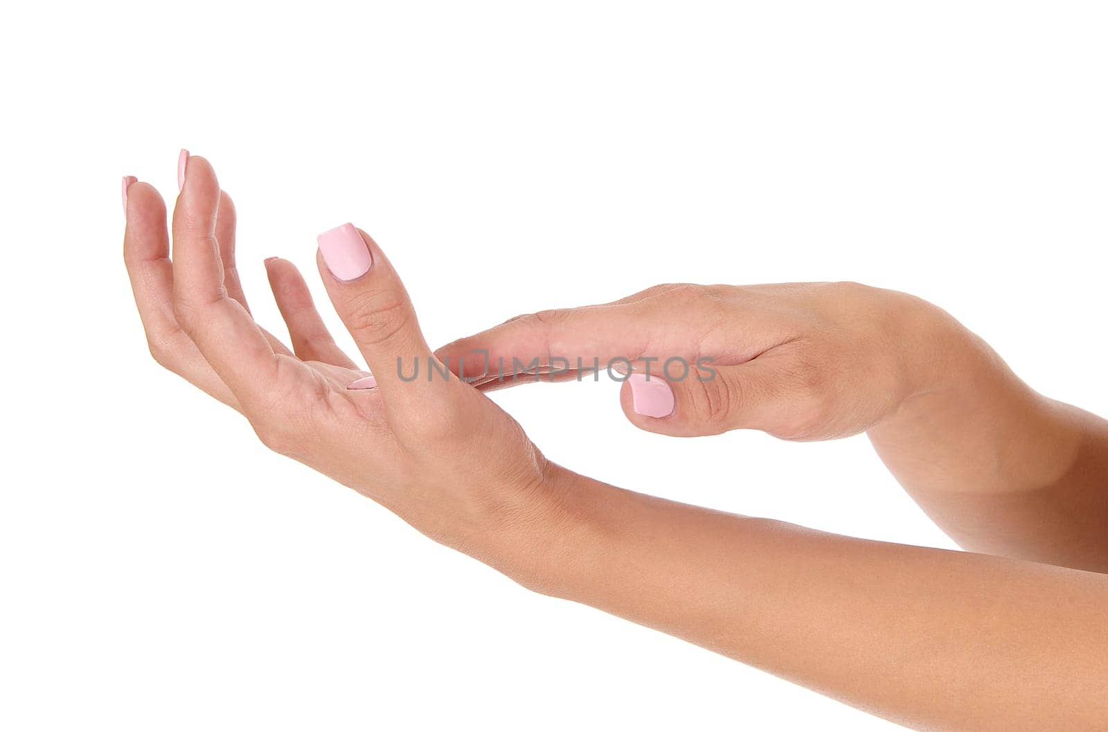 A close up of two ladies hands with polished pink finger nails, body.parts, isolated for white background.