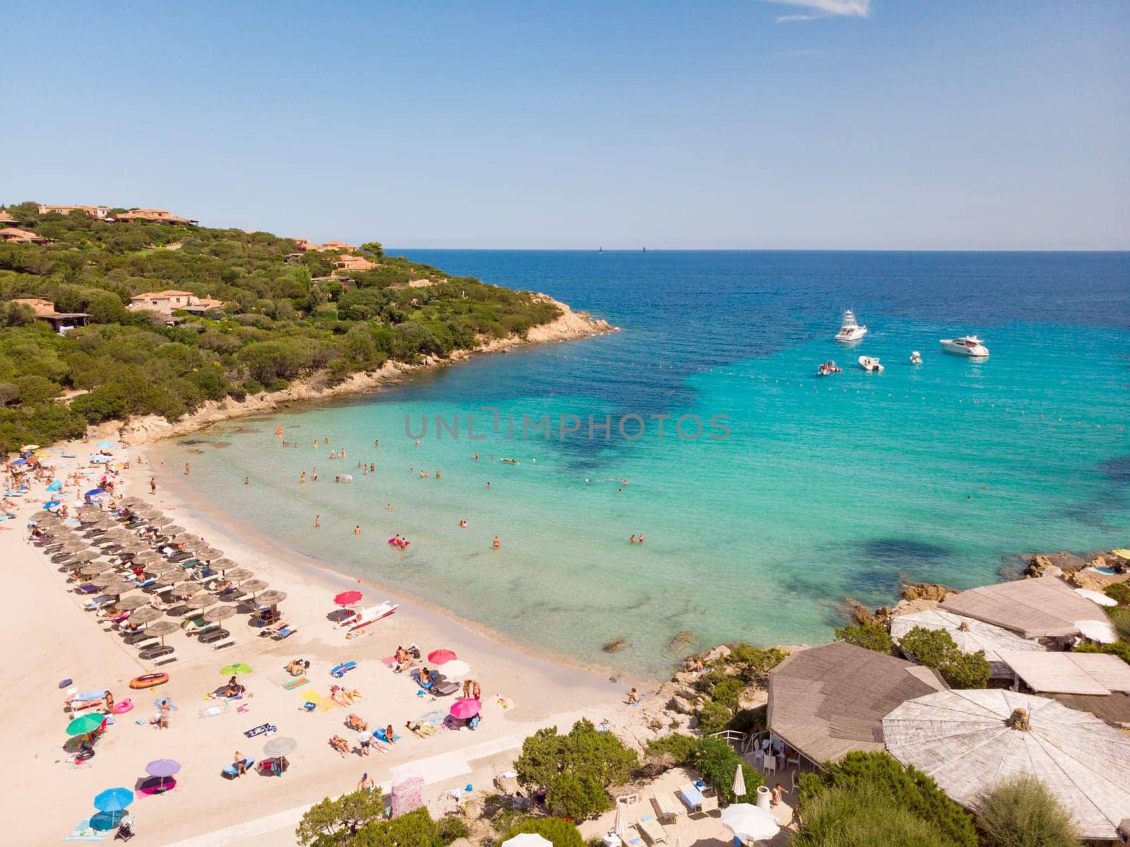 Wonderful turquoise blue colors of the sea of Cala Granu beach, bay near Porto Cervo in Costa Smeralda, Sardinia, Italy.