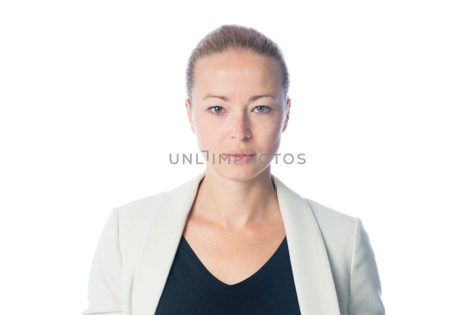 Portrait of casualy dressed,cheerful, beautiful, smart, young businesswoman in standing against white background.