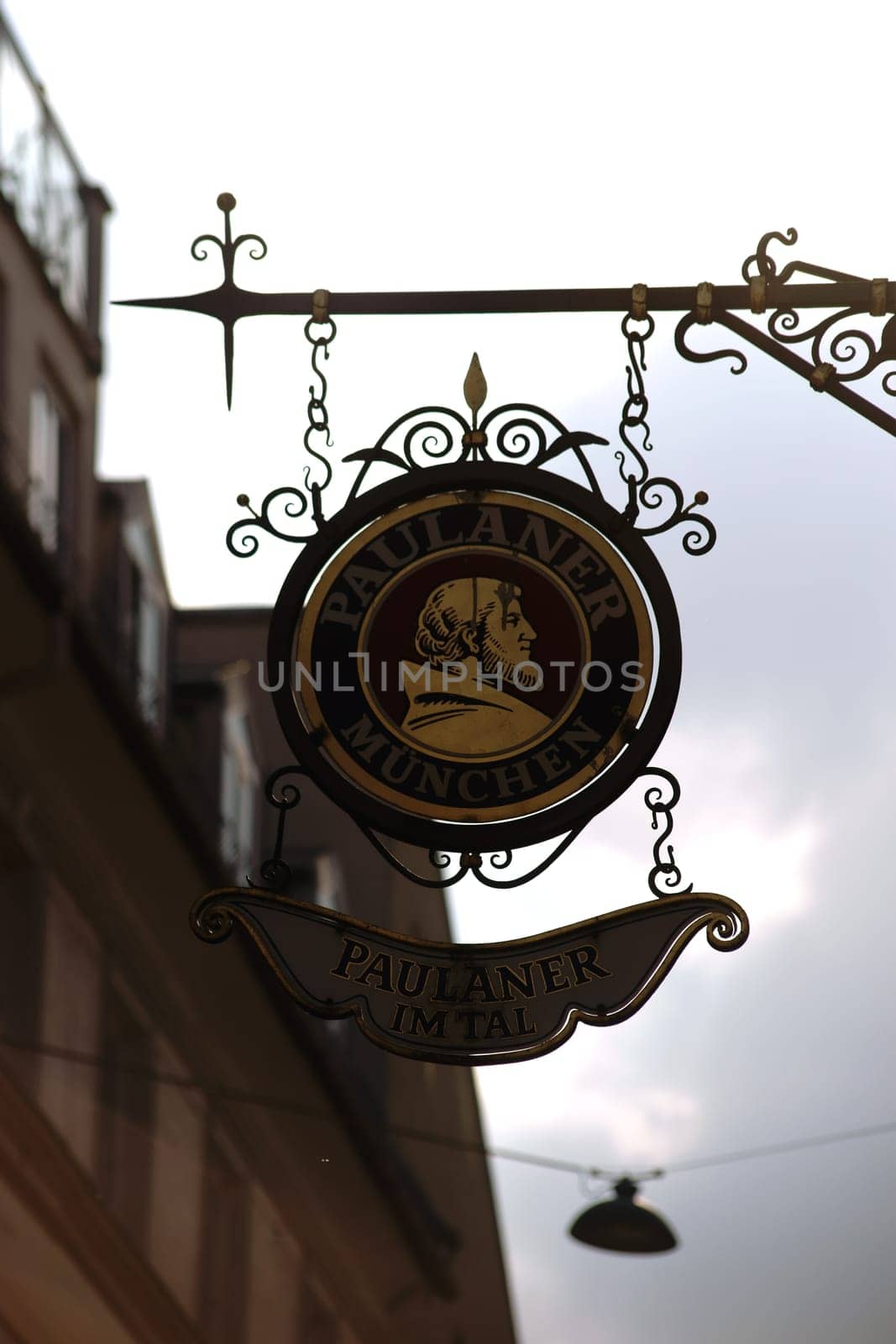 Munich, Germany - June 29, 2018: The coat of arms of the Paulaner beer brewery over an entrance of a restaurant on June 29, 2018 in Munich.