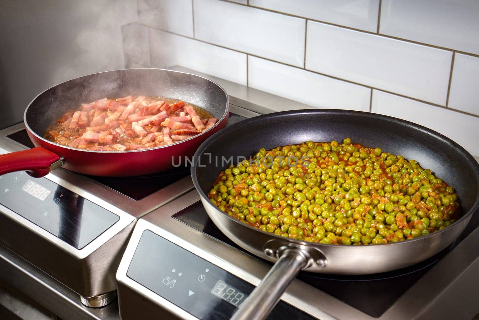 Low peas and pancetta cooked in pan on electric oven