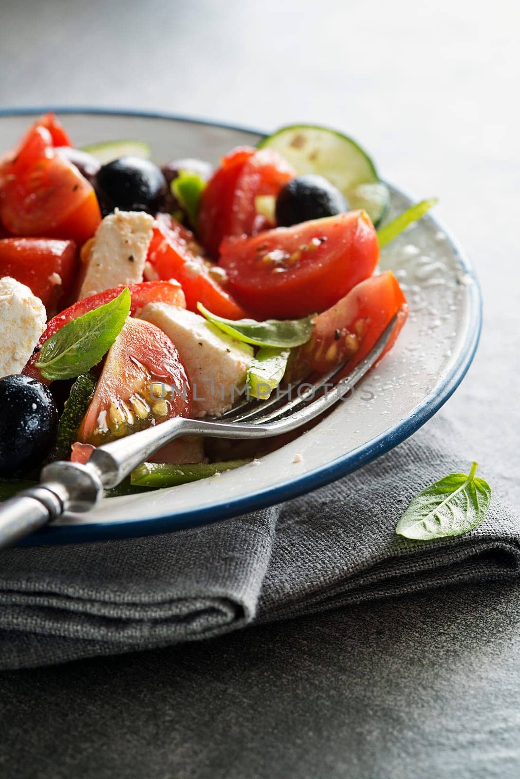 Salad with feta cheese and fresh tomatoes. Greek salad.
