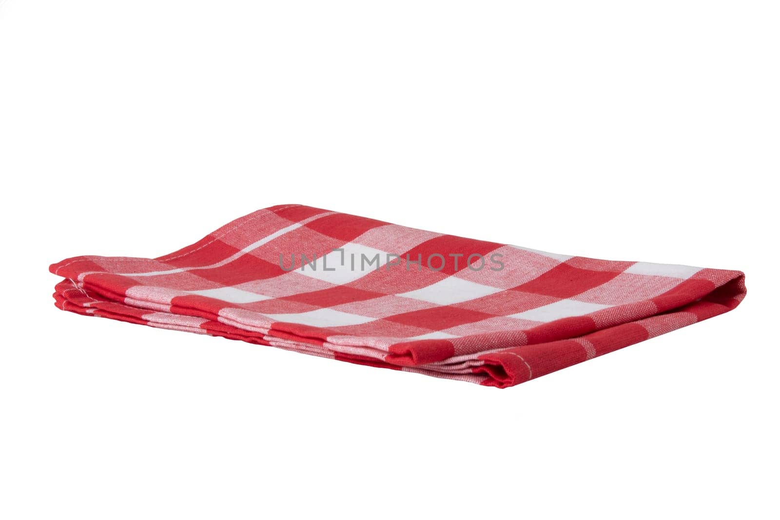 Red and white checkered napkin isolated on white background. Kittchen accessories.