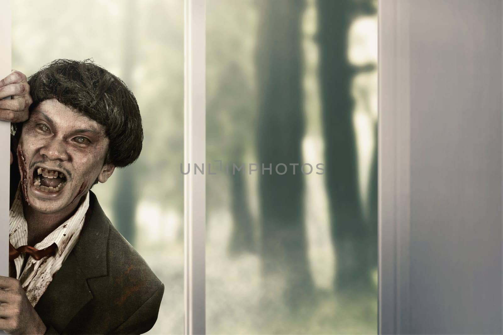 Creepy zombie man come into abandoned house. Halloween concept