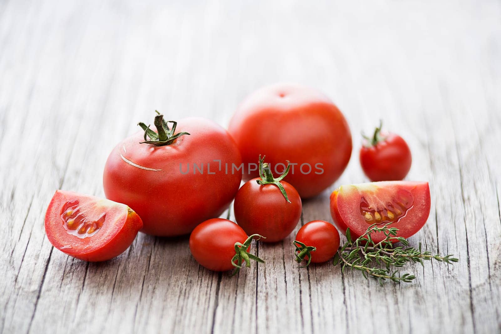 Fresh tomatoes with herbs. Concept for a tasty and healthy meal.