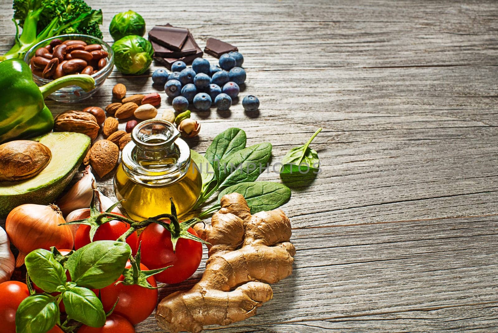 Selection of healthy food on wooden background. Healthy diet foods for heart cholesterol and diabetes.