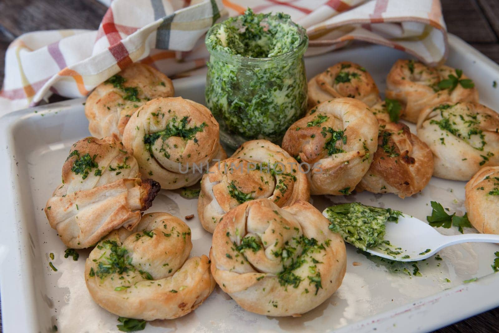 Savoury snack made from puff pastry with garlic herbal butter