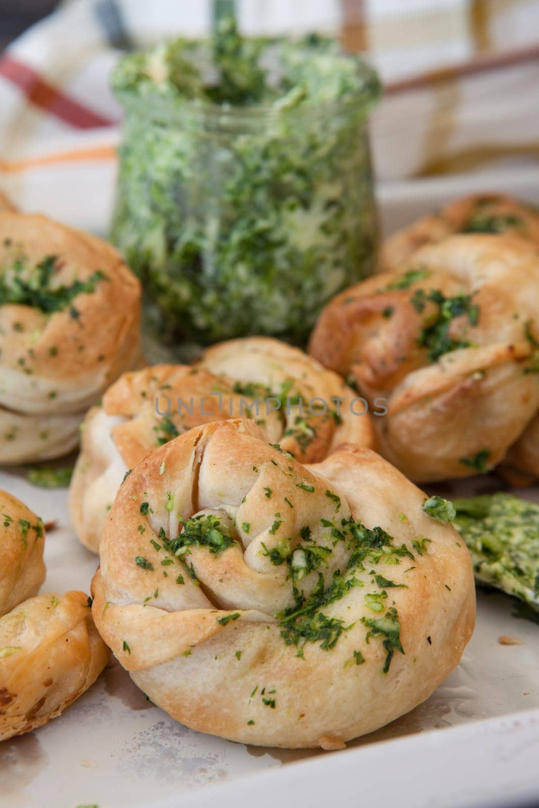 Savoury snack made from puff pastry with garlic herbal butter