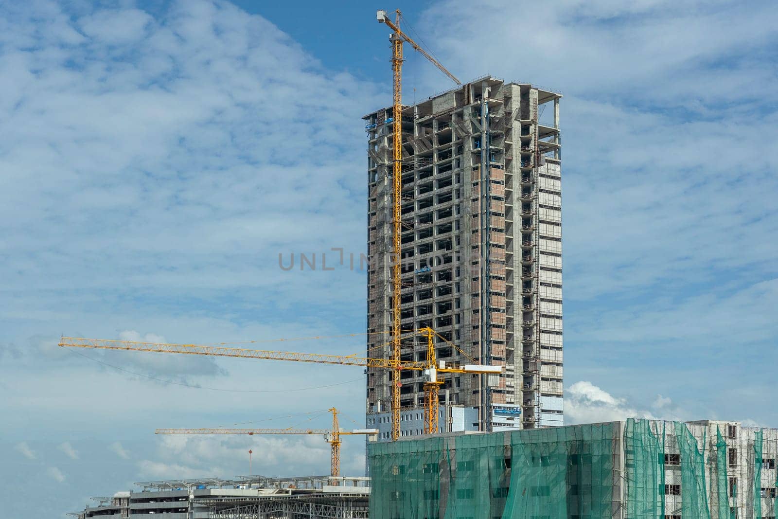 building site with cranes and blue sky
