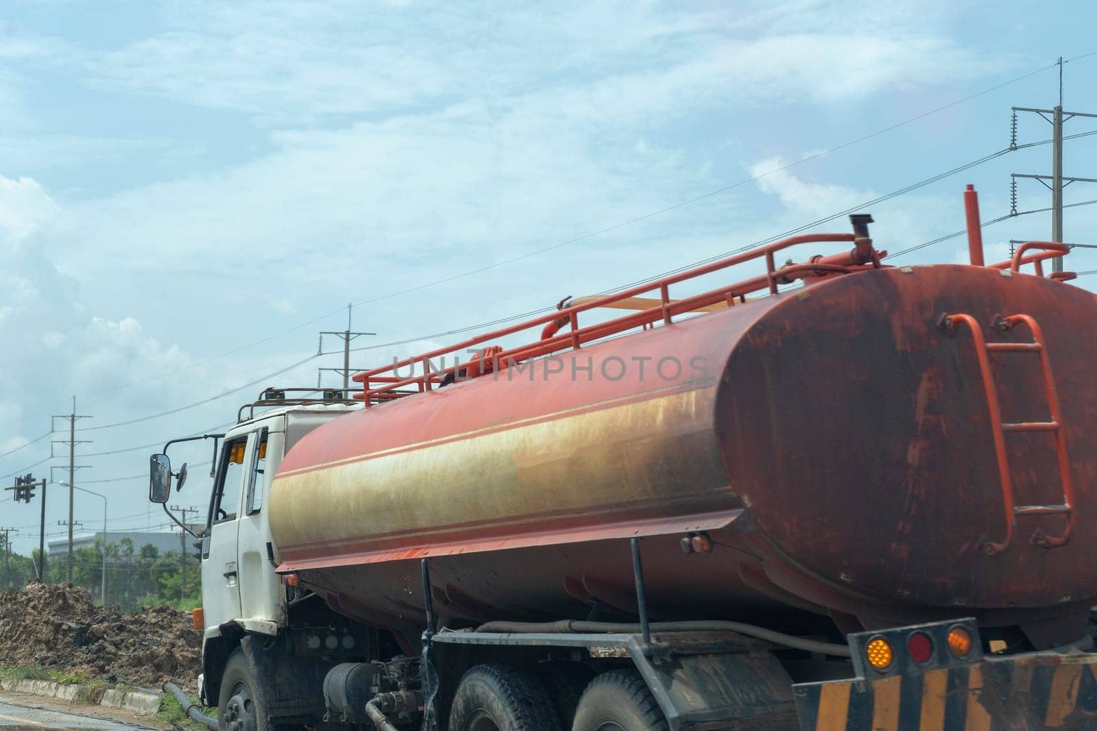 Truck of oil and old red on the road