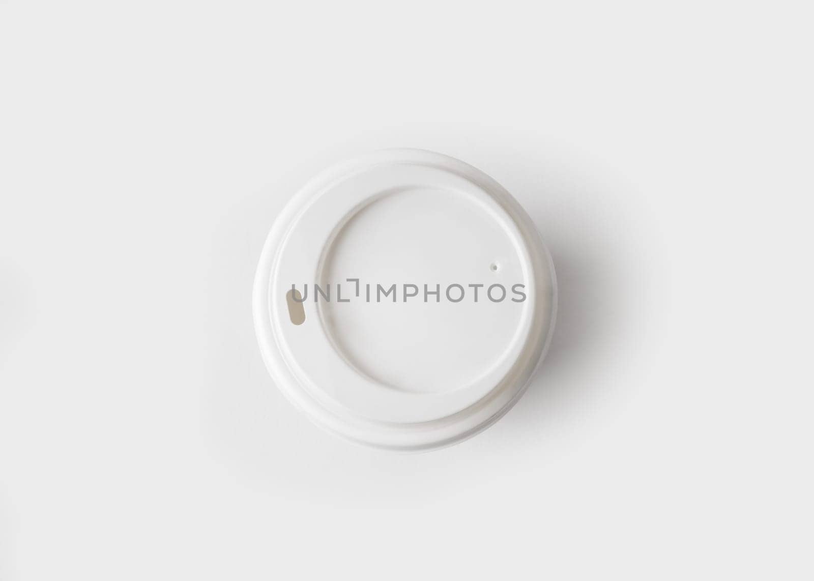 Top view of a disposable coffee cup with cap.