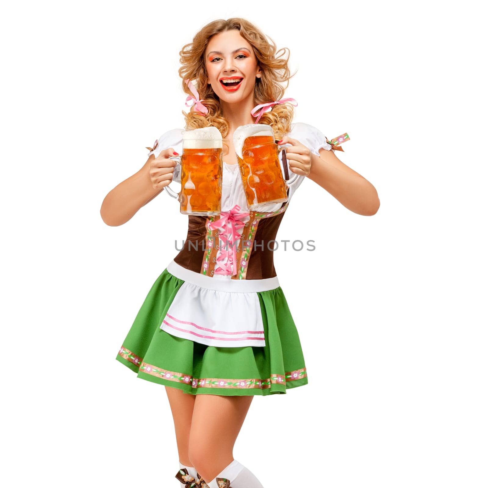 Creative concept photo of Oktoberfest waitress wearing a traditional Bavarian costume with beer isolated on white background.