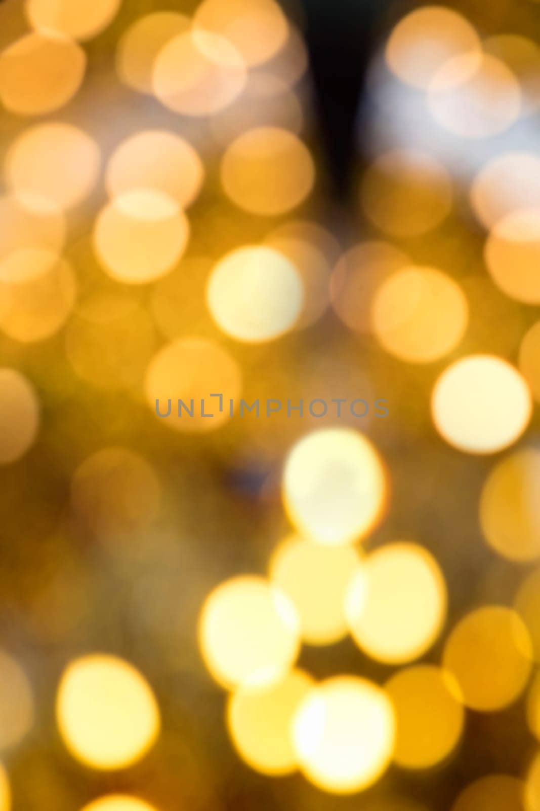 Blurry background image of defocused yellow abstract city street lights at night