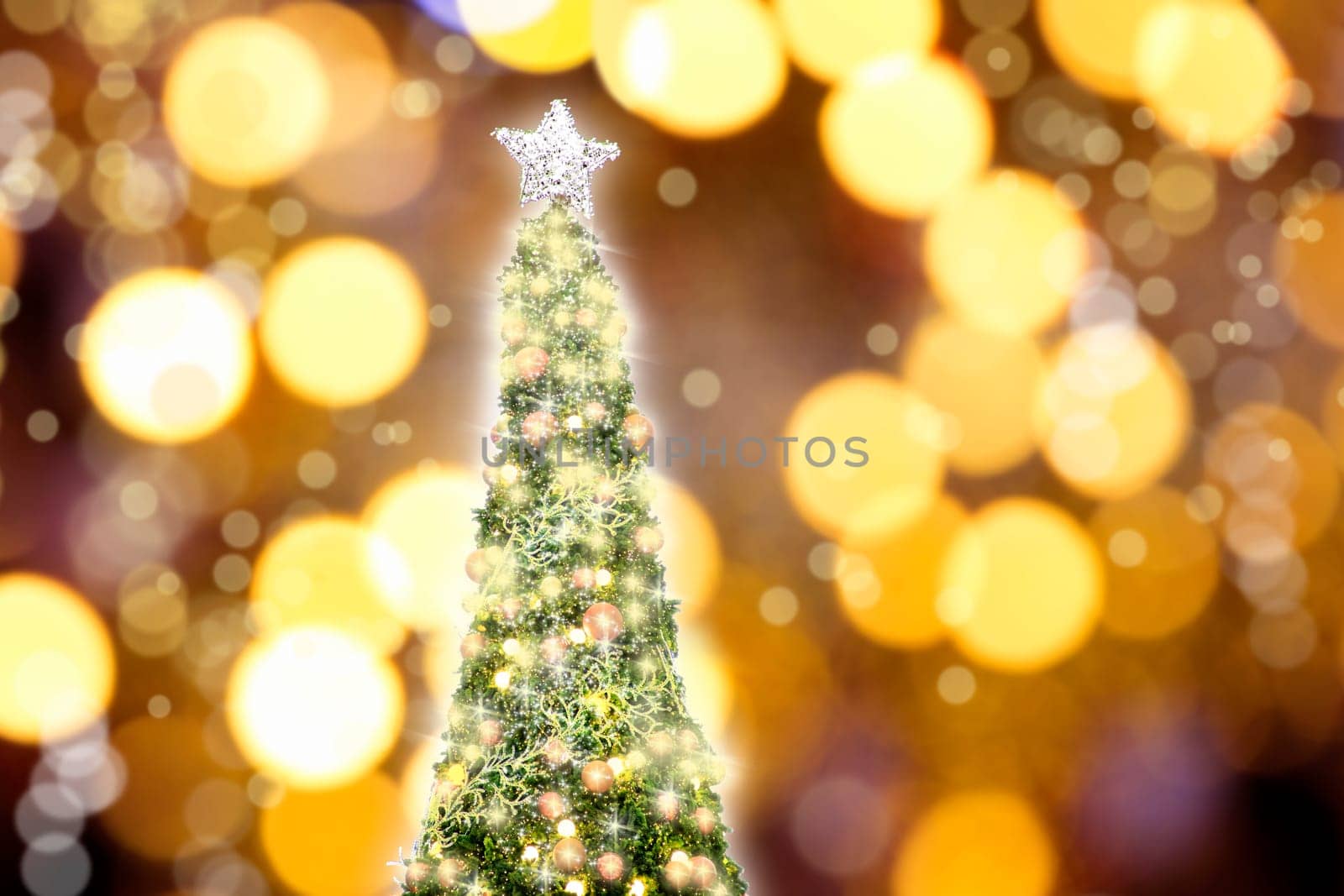 Conceptual image of decorated Christmas tree with colorful lights and ornaments
