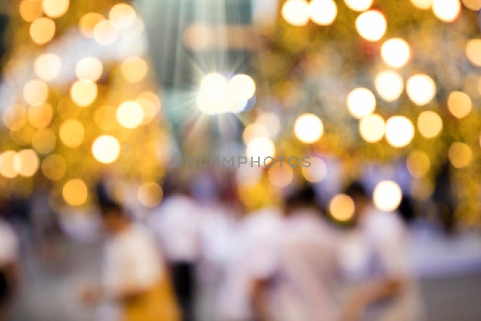 Conceptual abstract background image of defocused Christmas decoration on city street at night