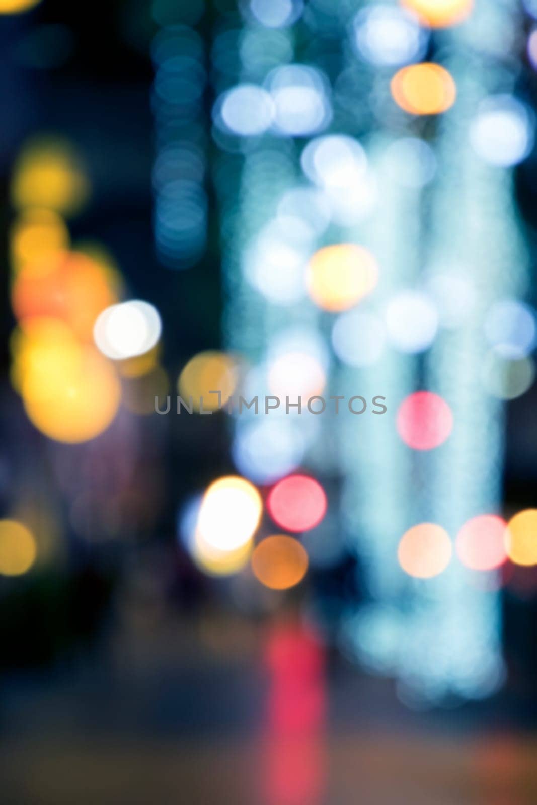 Blurry background image of defocused colorful abstract city street lights at night