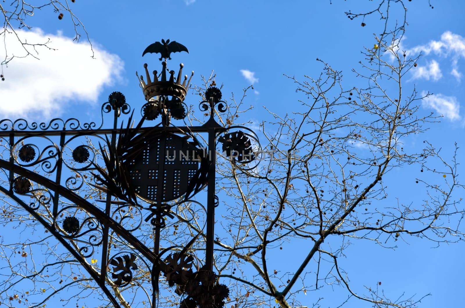 Street light with trees in downtown Barcelona, Spain