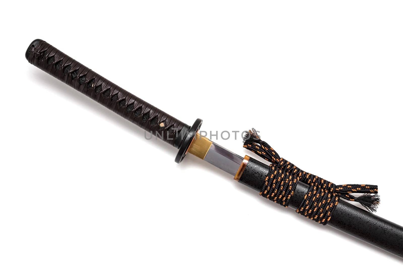Brown leather cord tie on grip Japanese sword steel fitting and black scabbard on white background.