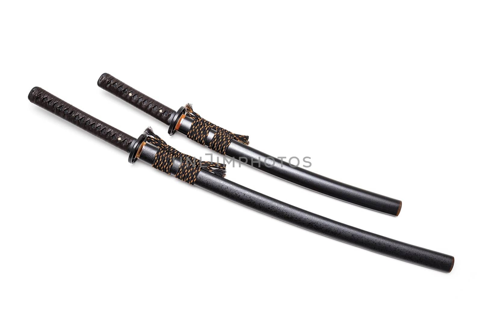 Brown leather cord tie on grip Japanese sword and black scabbard with steel fitting isolated in white background.