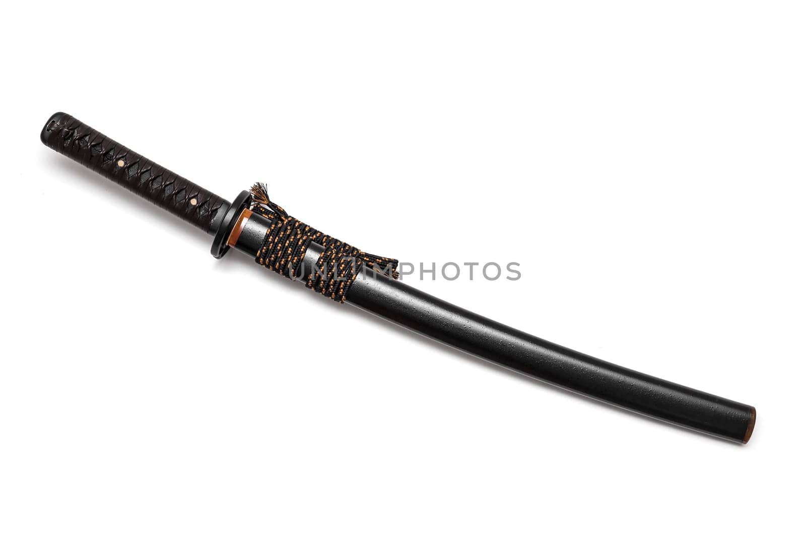 Brown leather cord tie on grip Japanese sword and black scabbard with steel fitting isolated in white background.