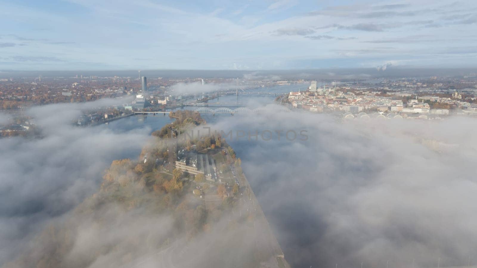Riga Latvia Daugava river Zakusala island smoke cloud island Aerial drone top view
