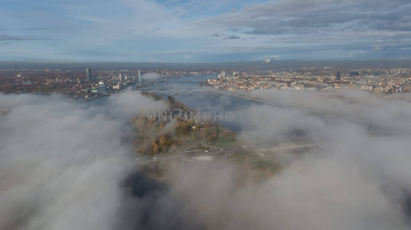 Riga Latvia Daugava river Zakusala island smoke cloud island Aerial drone top view