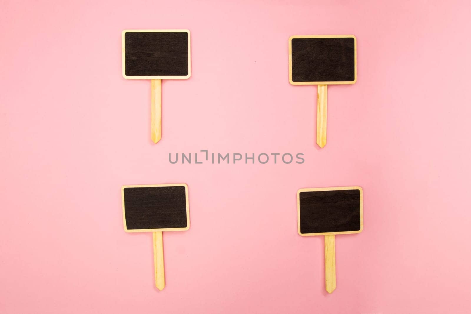Four little blank chalkboards on pink paper