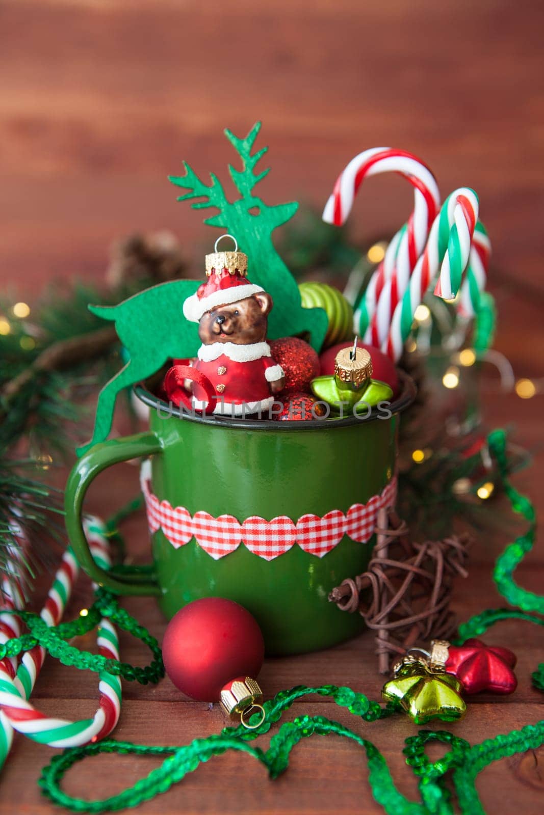 Rustic mug with colorful festive decorations for a merry christmas