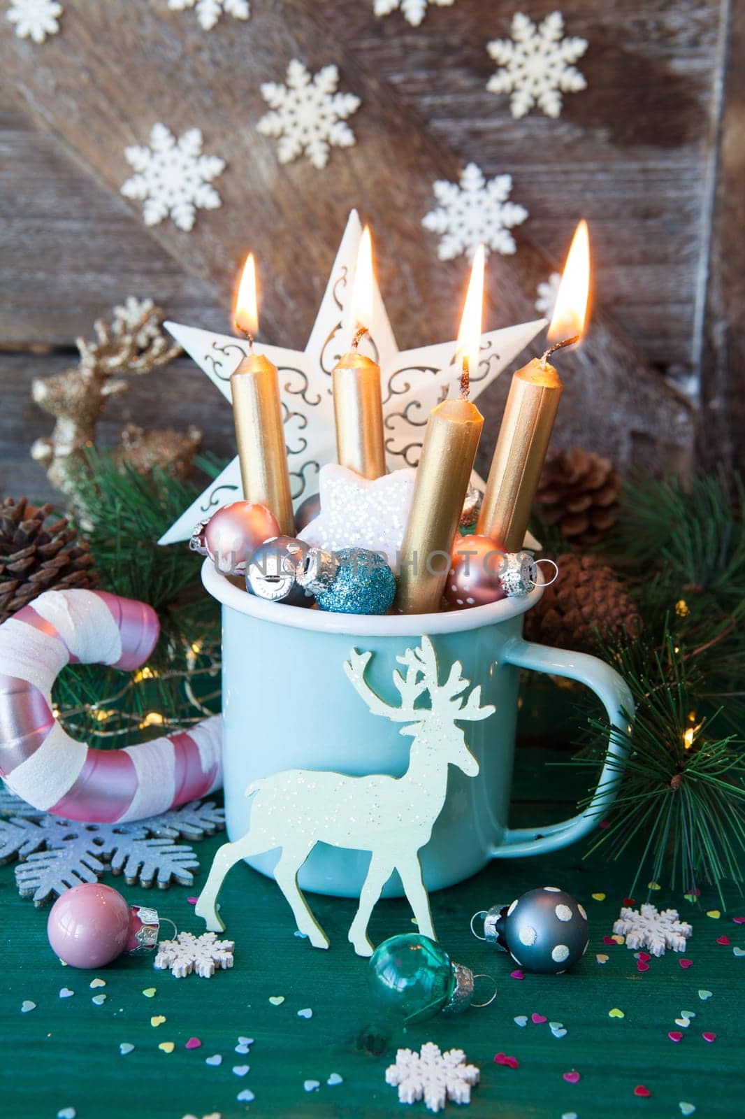 Rustic mug with colorful festive decorations for a merry christmas