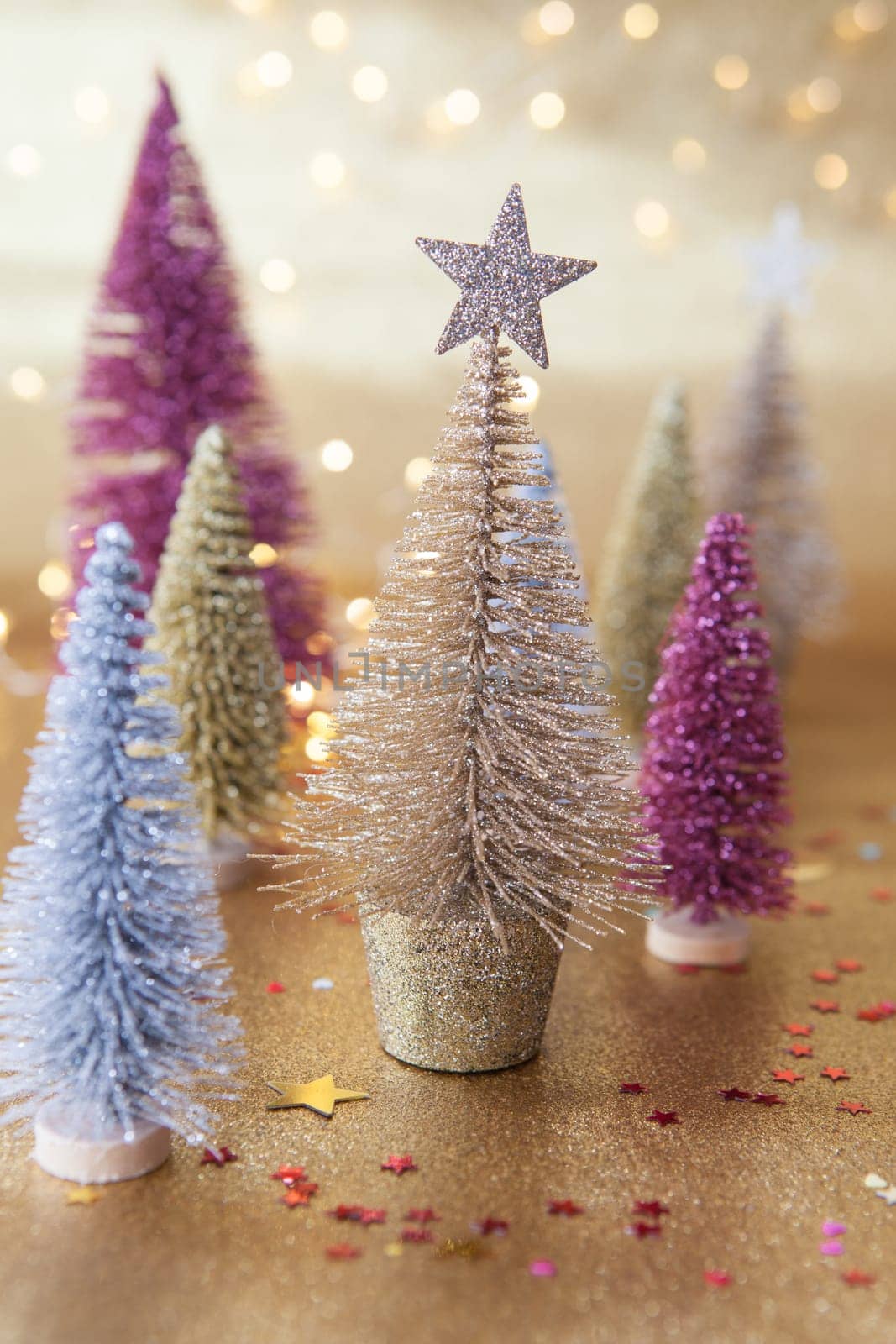 Little glittery christmas trees with festive lights
