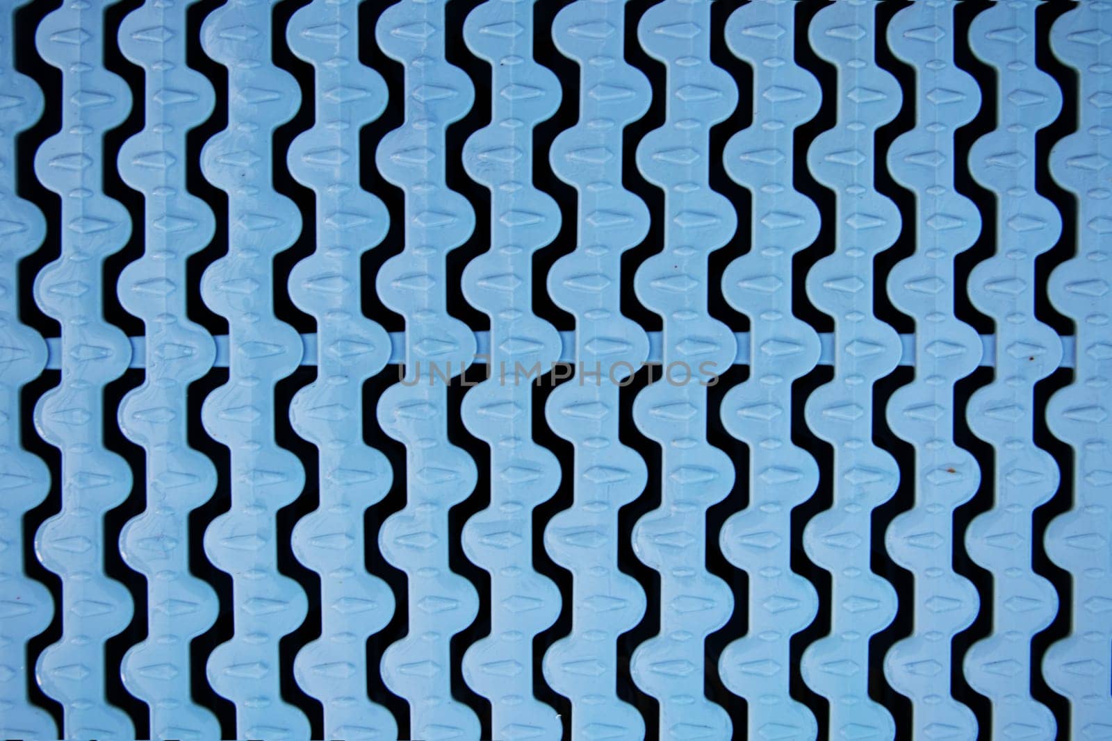 Closeup of blue plastic swimming overflow in a swimming pool. Swimming pool backgrounds.