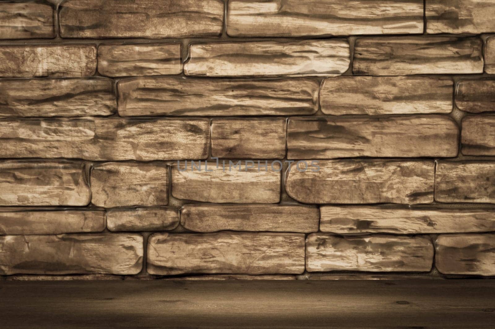 Wall of brown bricks and wooden boards with spot lighting.