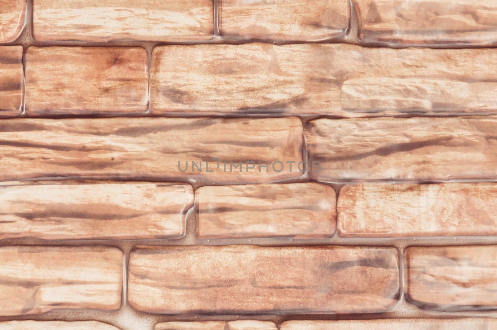 Background wall of large bricks of red close-up.