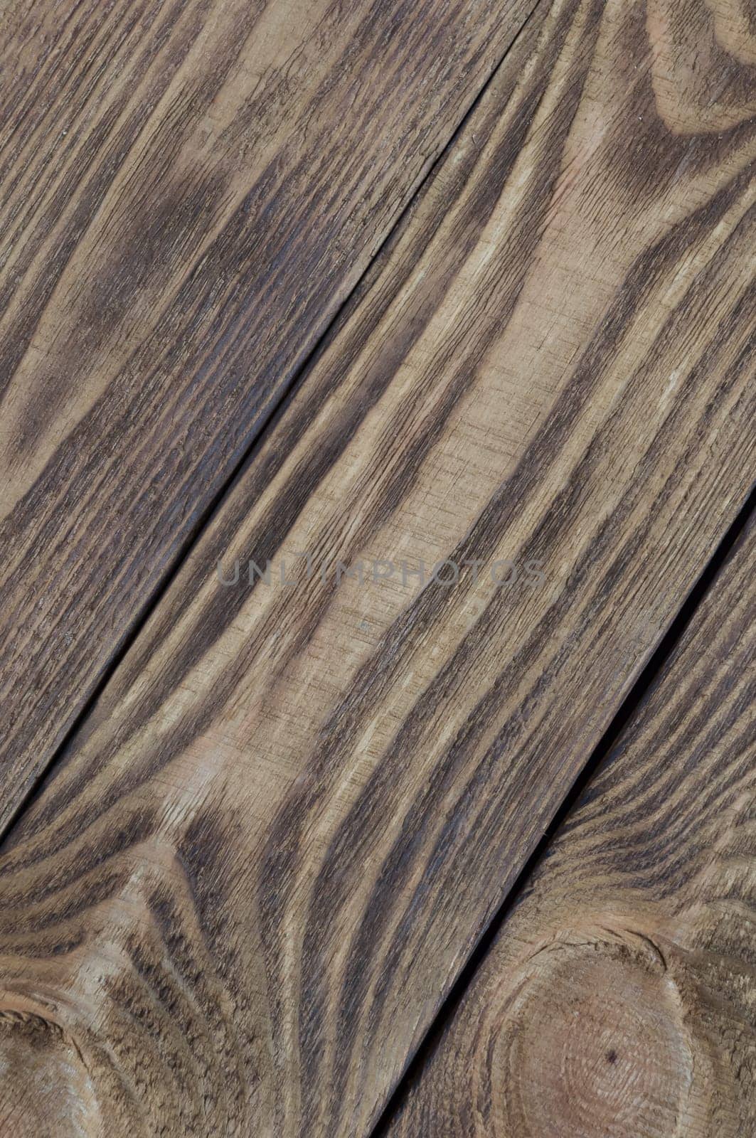 Background of textured boards of light wood arranged from diagonally