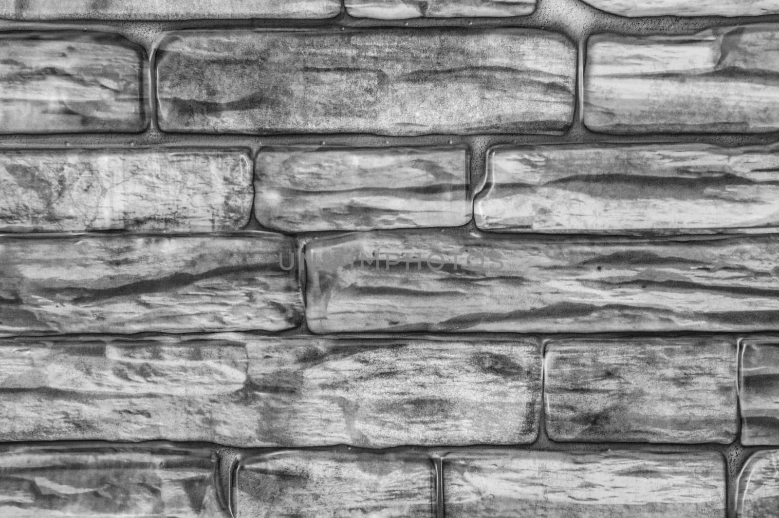 Wall of bricks close-up black and white.