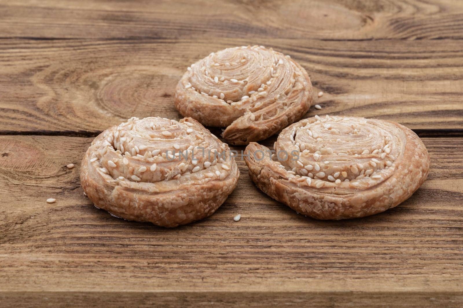 Biscuits with sesame on a wooden table