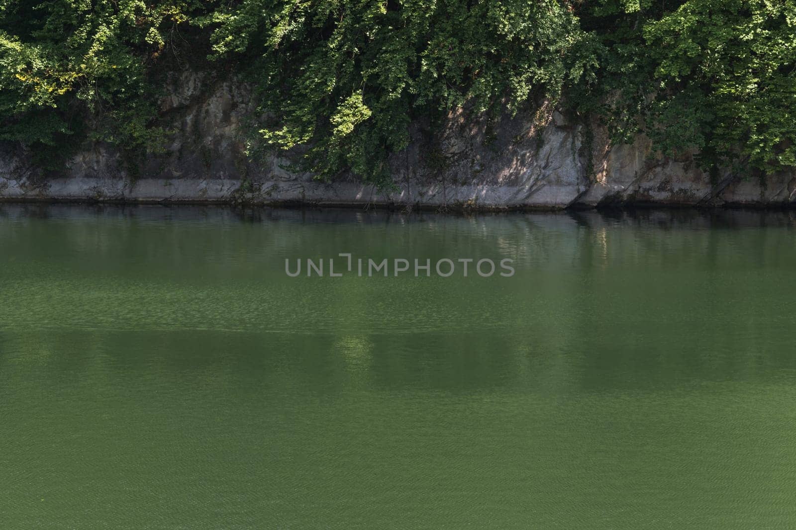 Lake with banks on the site of a former quarry for the extraction of limestone