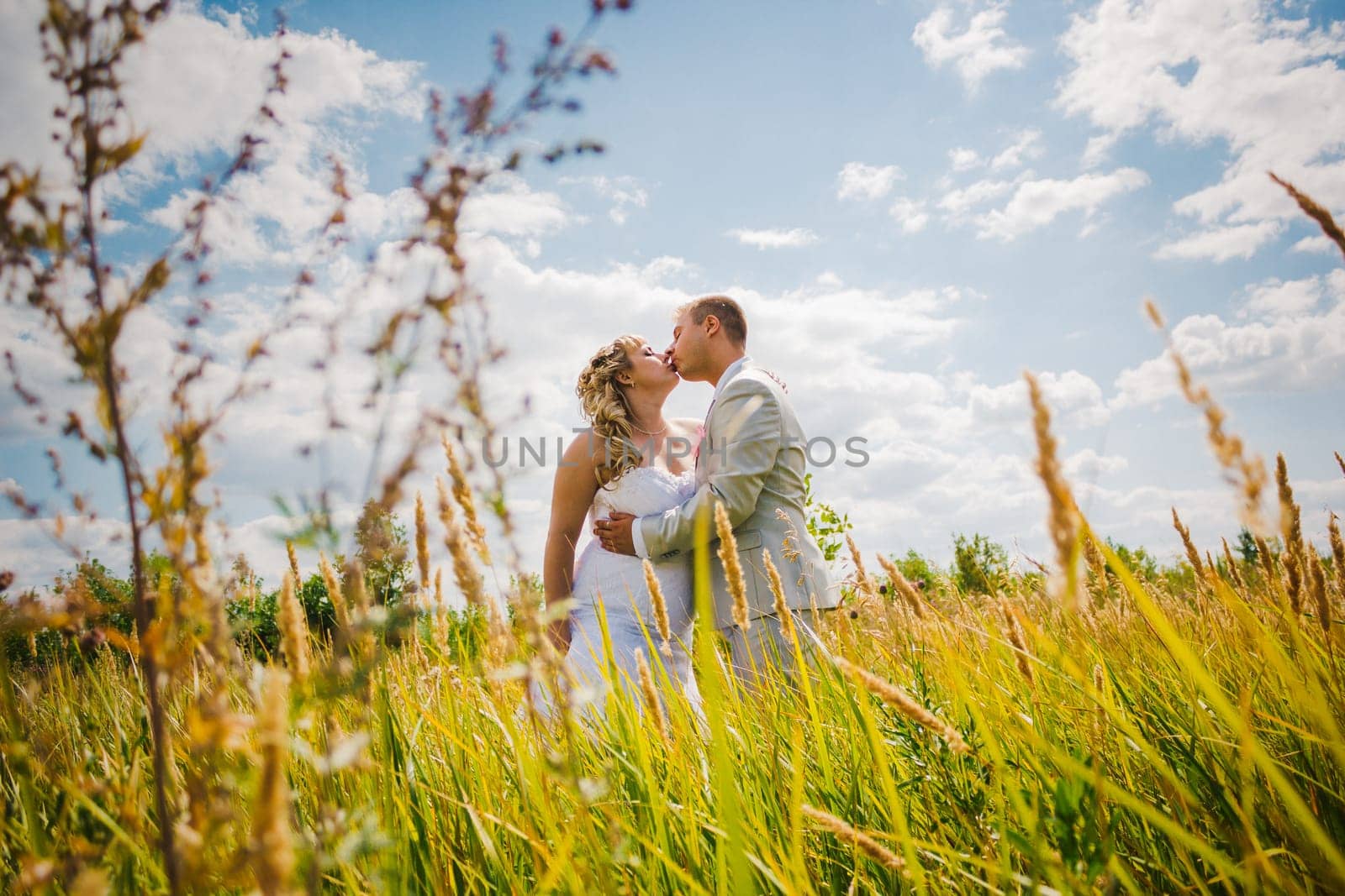 beautiful young couple stand on background forest
