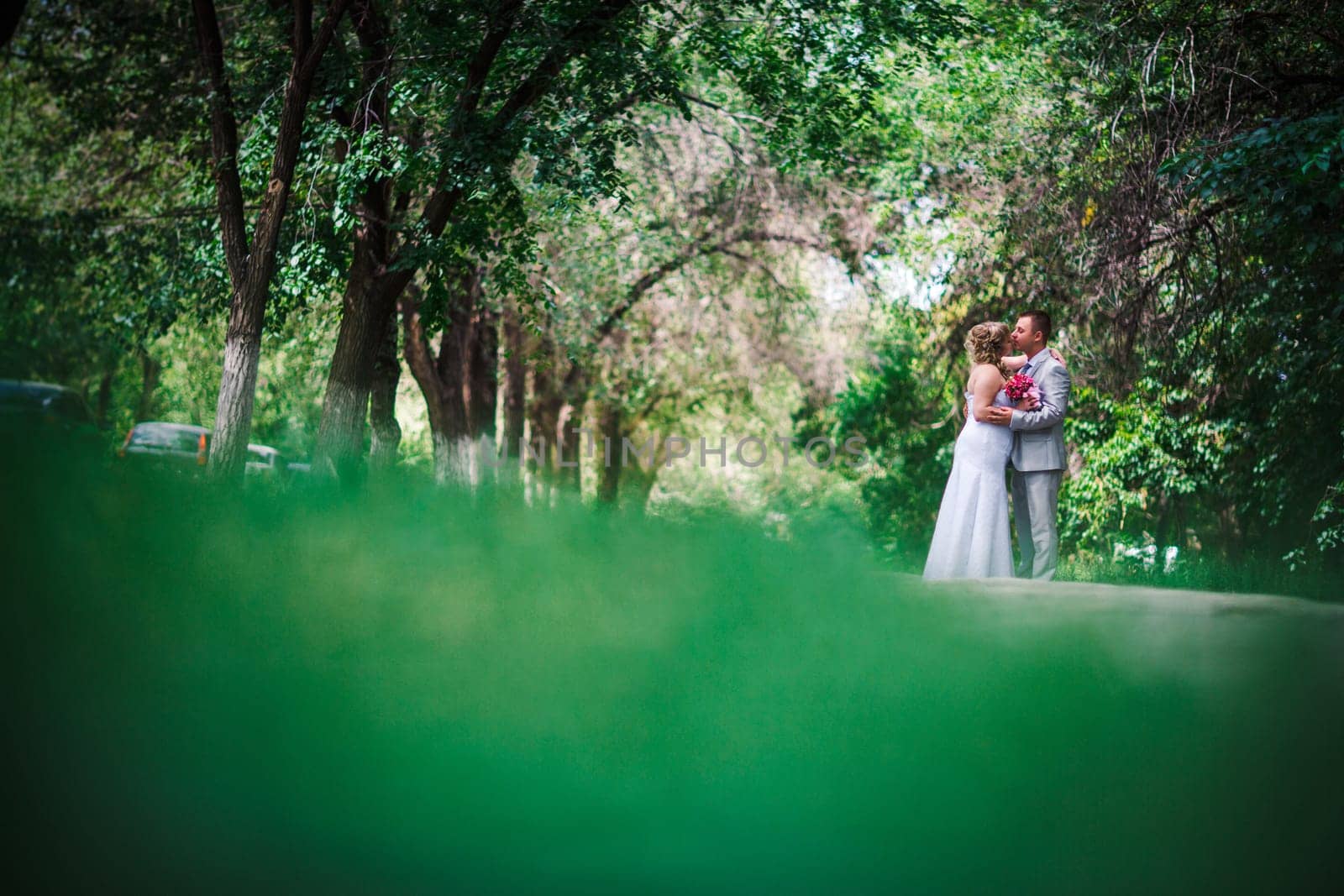 beautiful young couple stand on background forest
