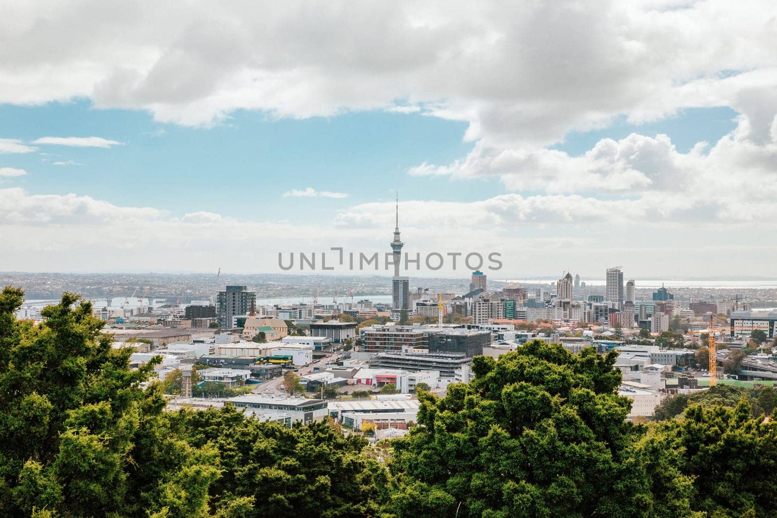 Auckland view from Mt Eden with a person walking along the path towards the city, New Zealand