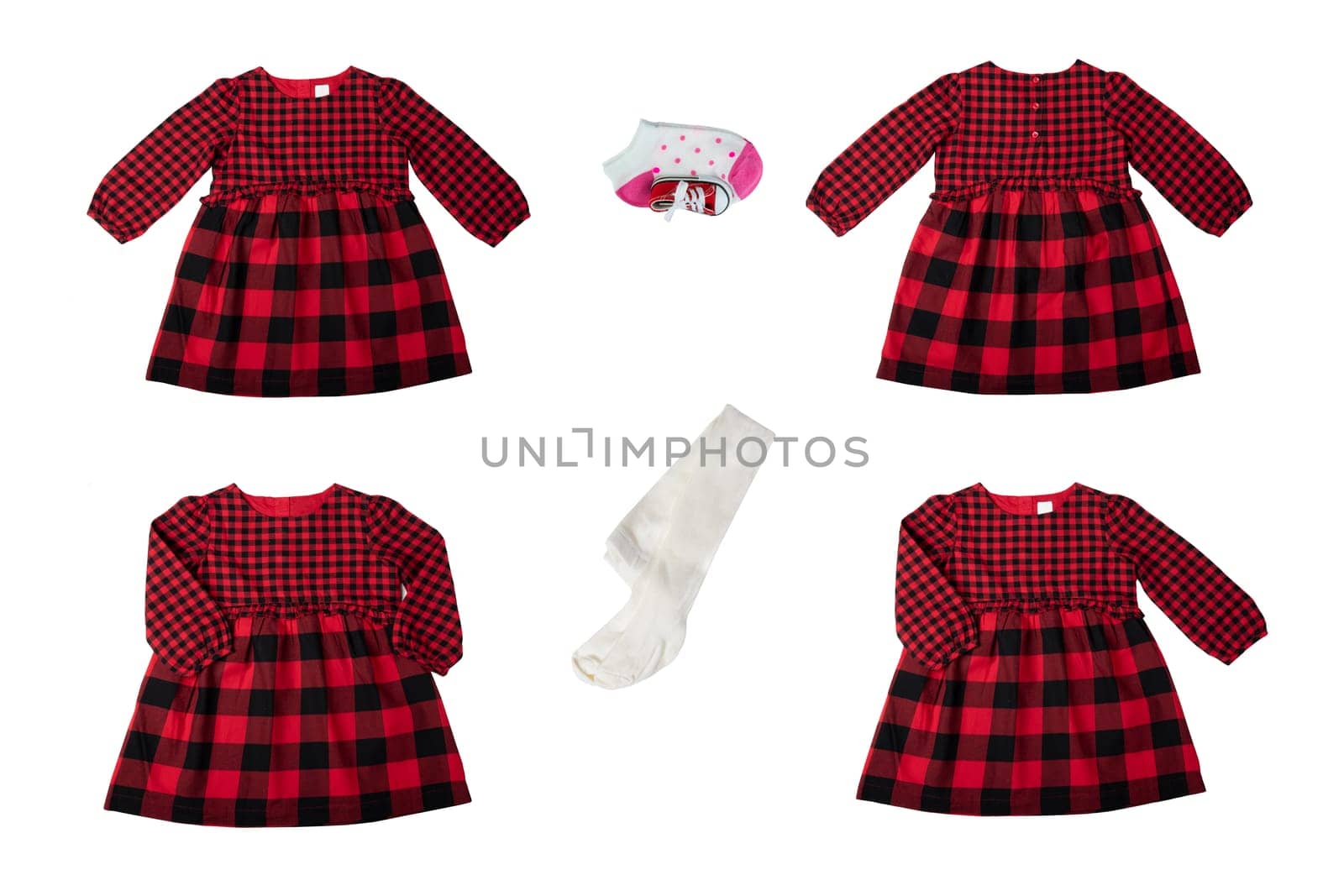 Clothes for children. A set of a beautiful red and black checkered girl dress isolated on a white background. Children fashion.