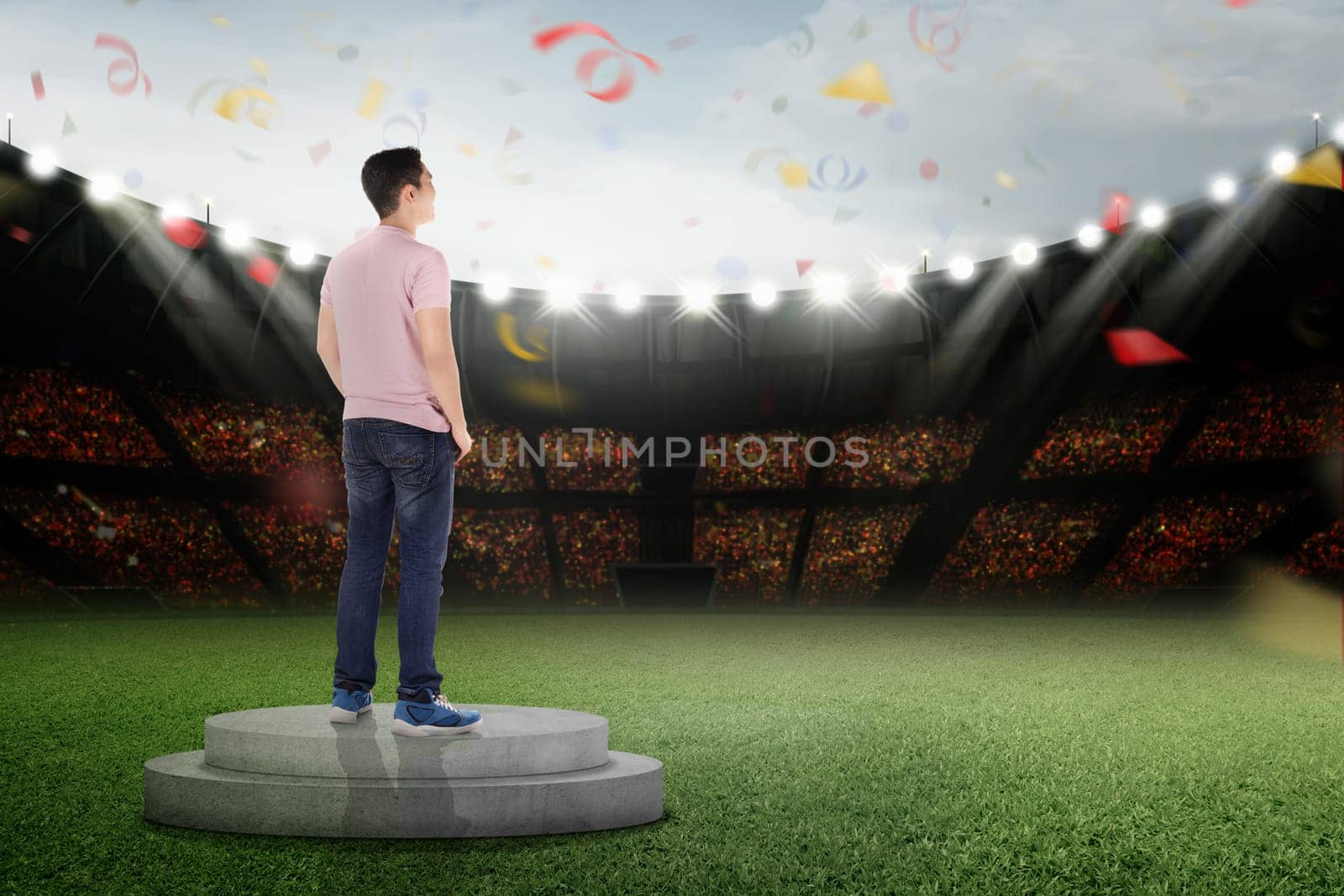 Happy asian man standing on podium with confetti in the air