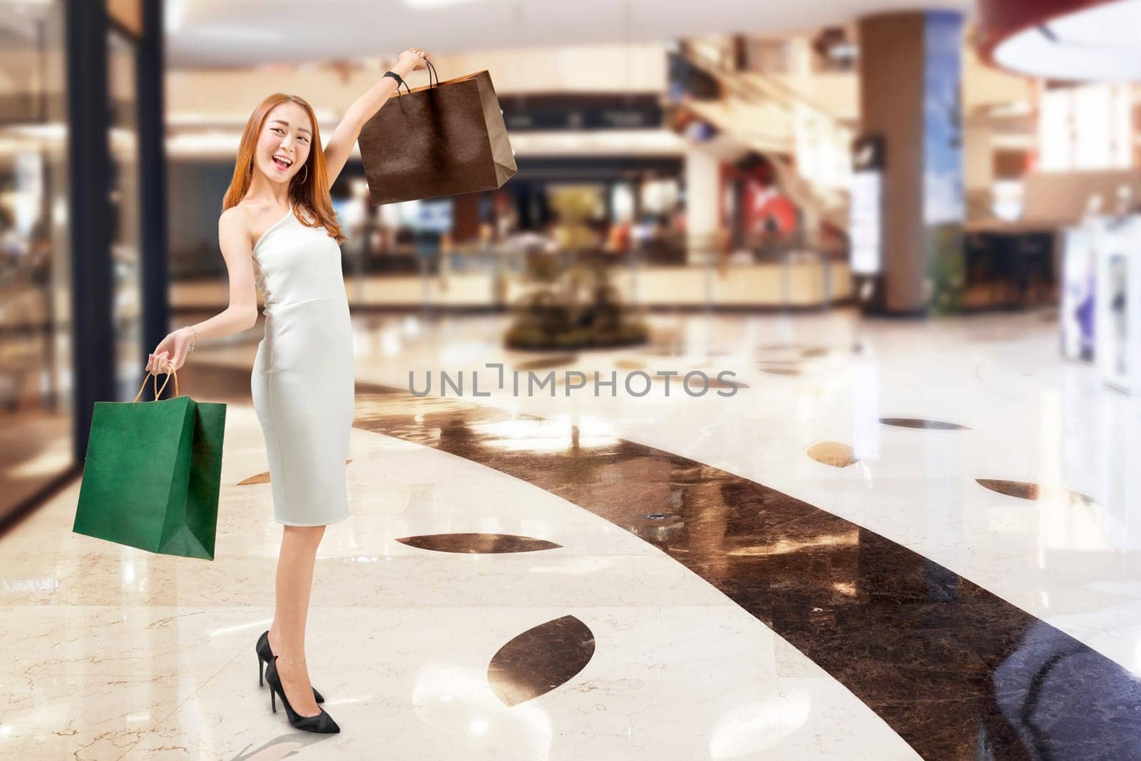 Young asian woman in white dress shopping at mall. Black friday concept